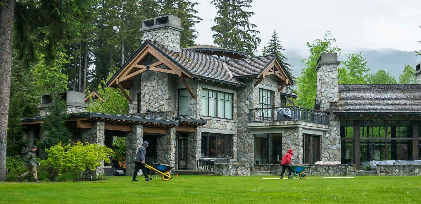Holiday lights on modern house in winter after snowfall