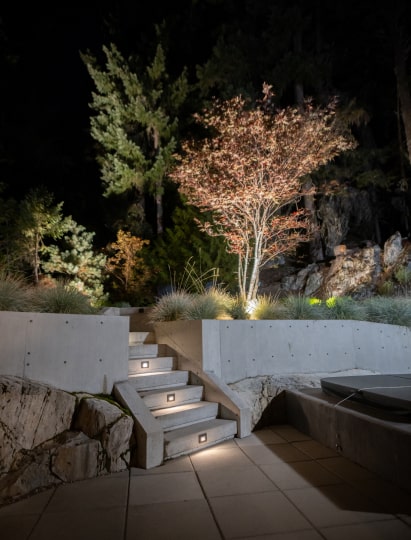 Illuminated fire feature steps night