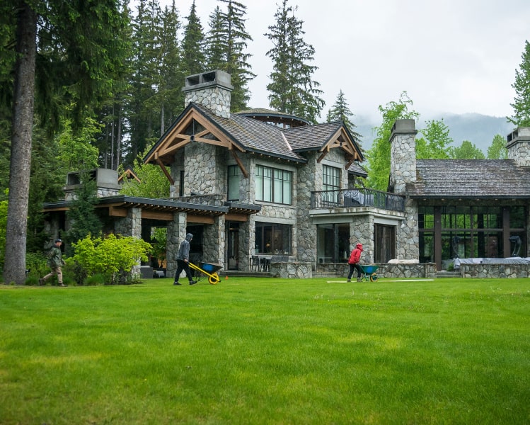 Timber lodge home manicured lawn